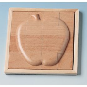 Το ξύλινο ανάγλυφο παζλ Beleduc 30215 σε σχήμα μήλου με τα σκαλισμένα κομμάτια του.