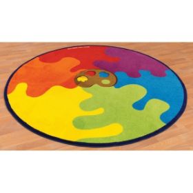 Ο Kit for Kids MAT086 – Στρογγυλός Οικολογικός Τάπητας "Παλέτα Χρωμάτων", τοποθετημένος σε ξύλινο πάτωμα.